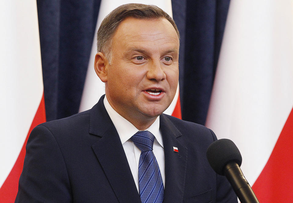 Polish President Andrzej Duda announces that he is vetoing a law on elections to the European Union Parliament that would have benefited large political parties and made it harder for small parties to reach a threshold to get seats, in Warsaw, Poland, Thursday, Aug. 16, 2018. (AP Photo/Czarek Sokolowski)