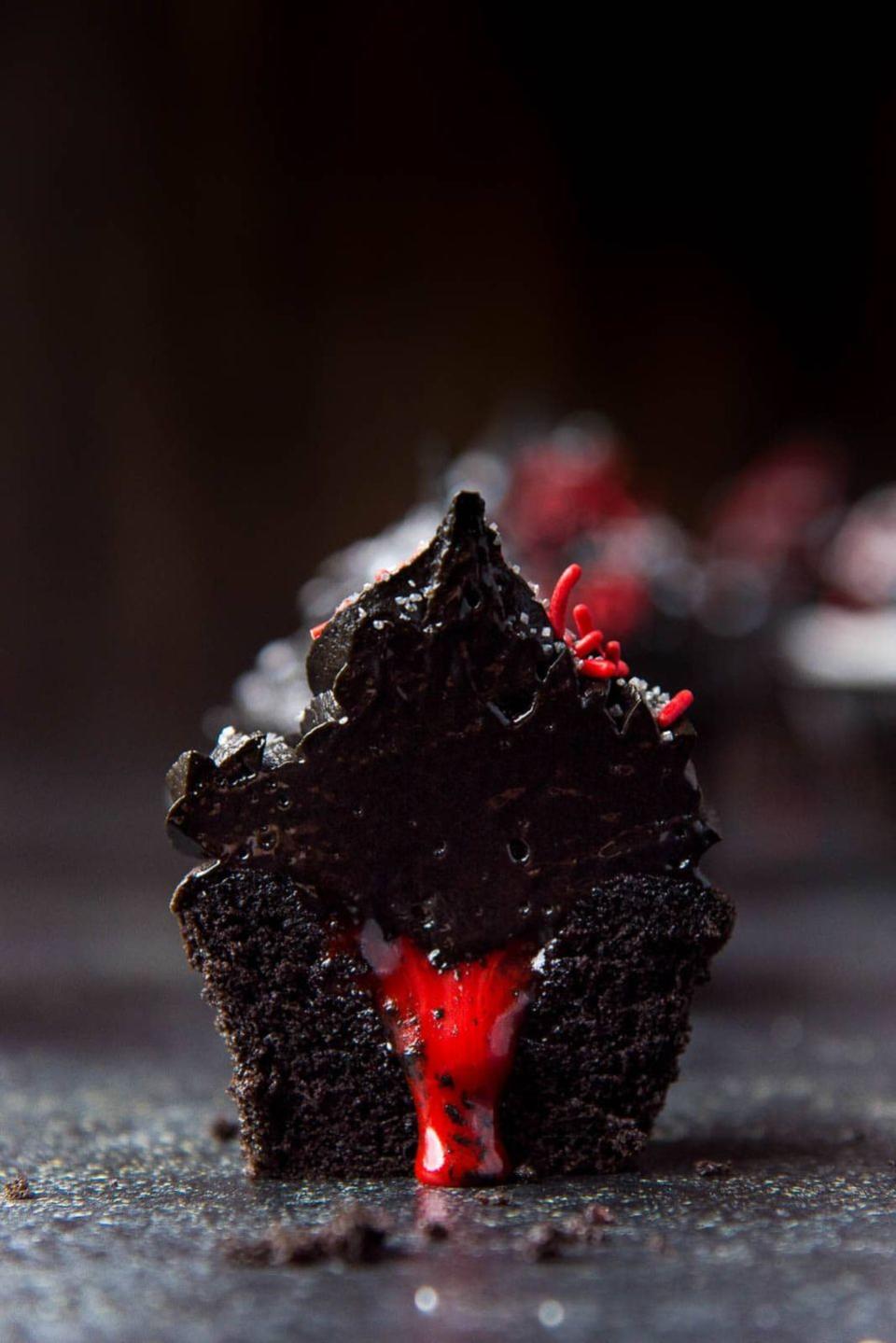 <p>Black chocolate cupcakes filled with rose-flavored white chocolate ganache and topped with chocolate buttercream will have everyone freaked out... and asking for seconds.</p><p><em><a href="https://www.theflavorbender.com/bleeding-halloween-black-cupcakes/" rel="nofollow noopener" target="_blank" data-ylk="slk:Get the recipe from The Flavor Bender »;elm:context_link;itc:0;sec:content-canvas" class="link ">Get the recipe from The Flavor Bender »</a></em></p>