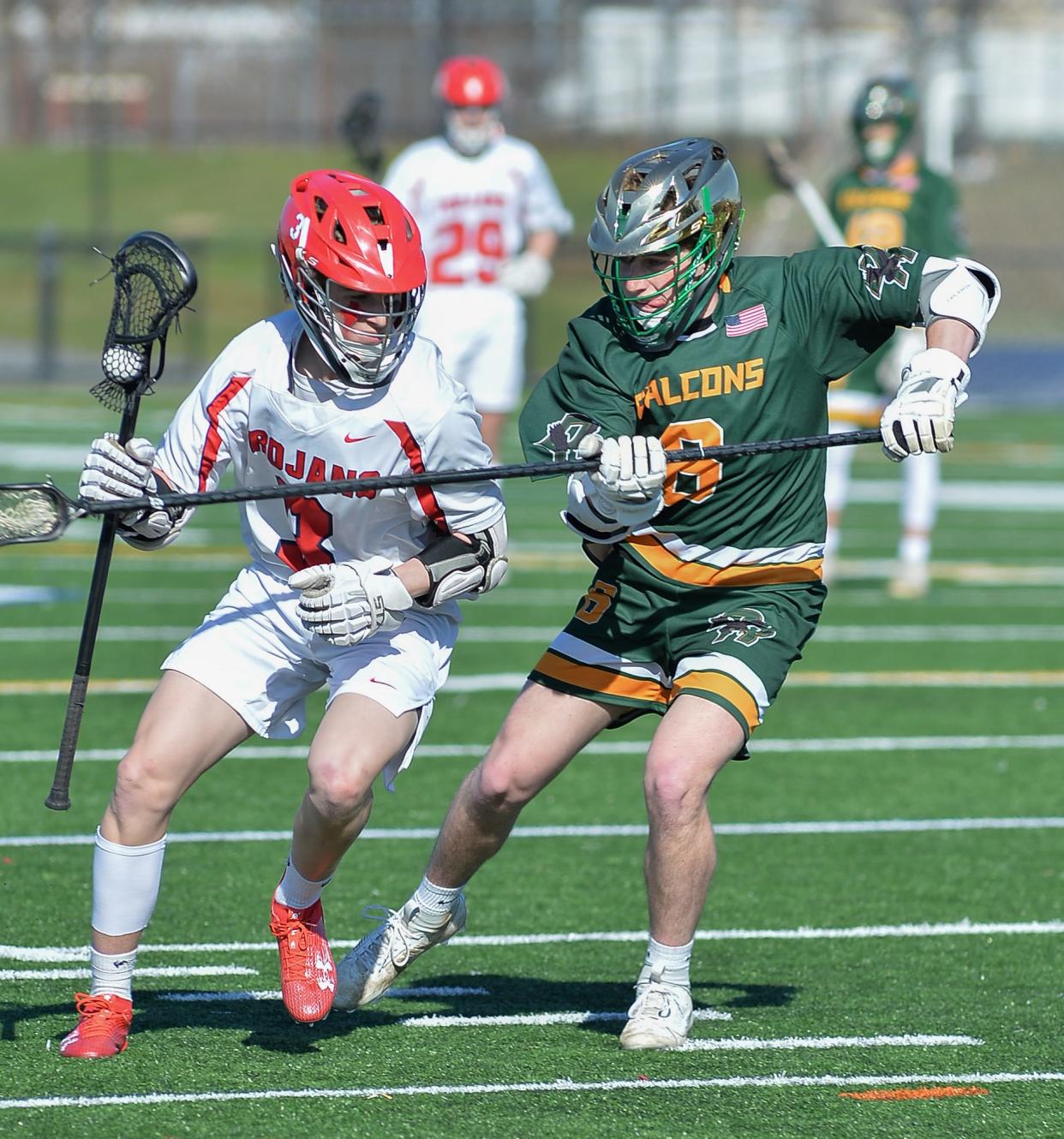 Bridgewater-Raynham’s Brendan Rosher is checked by Dighton-Rehoboth’s Noah Bastis during a non-league game on April 10, 2023.