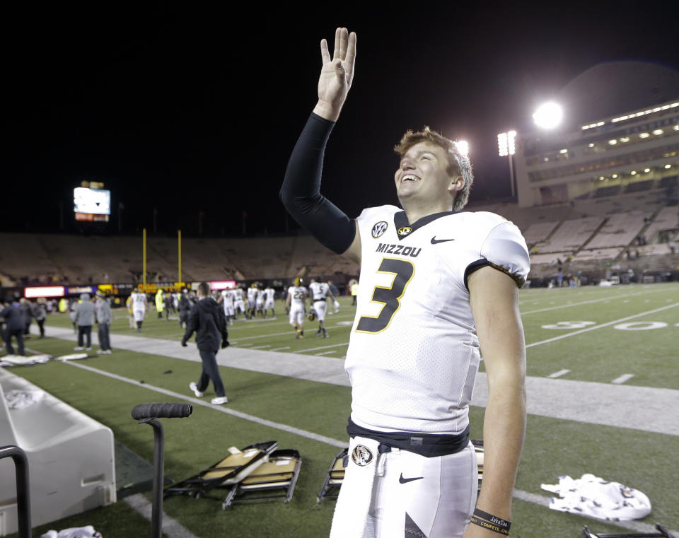 Missouri quarterback Drew Lock waves to fans after beating Vanderbilt in an NCAA college football game Saturday, Nov. 18, 2017, in Nashville, Tenn. Missouri won 45-17. (AP Photo/Mark Humphrey)