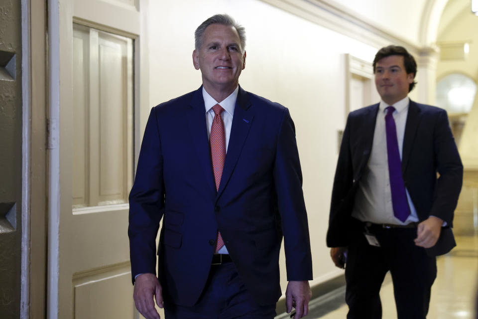 Representative Kevin McCarthy walks along a Capitol hallway.