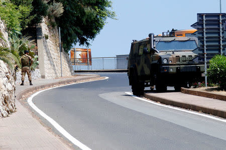 An Italian Army officer patrols on a road in Taormina, Italy, May 23, 2017. REUTERS/Antonio Parrinello