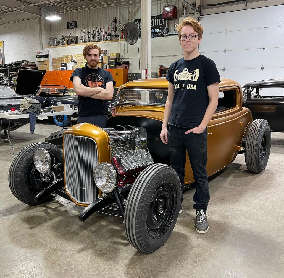 Logan Kucharek, left and his brother, Tanner with their 1932 Ford with flathead V8 engine at the Brothers Custom Automotive in Troy.