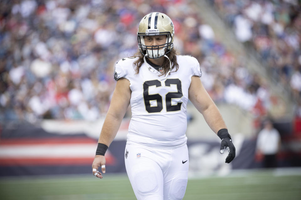 New Orleans Saints center Austin Reiter (62) walks off the field against the <a class="link " href="https://sports.yahoo.com/nfl/teams/new-england/" data-i13n="sec:content-canvas;subsec:anchor_text;elm:context_link" data-ylk="slk:New England Patriots;sec:content-canvas;subsec:anchor_text;elm:context_link;itc:0">New England Patriots</a> during the first half of an NFL football game, Sunday, Sept. 26, 2021, in Foxborough, Mass. (AP Photo/Greg M. Cooper)