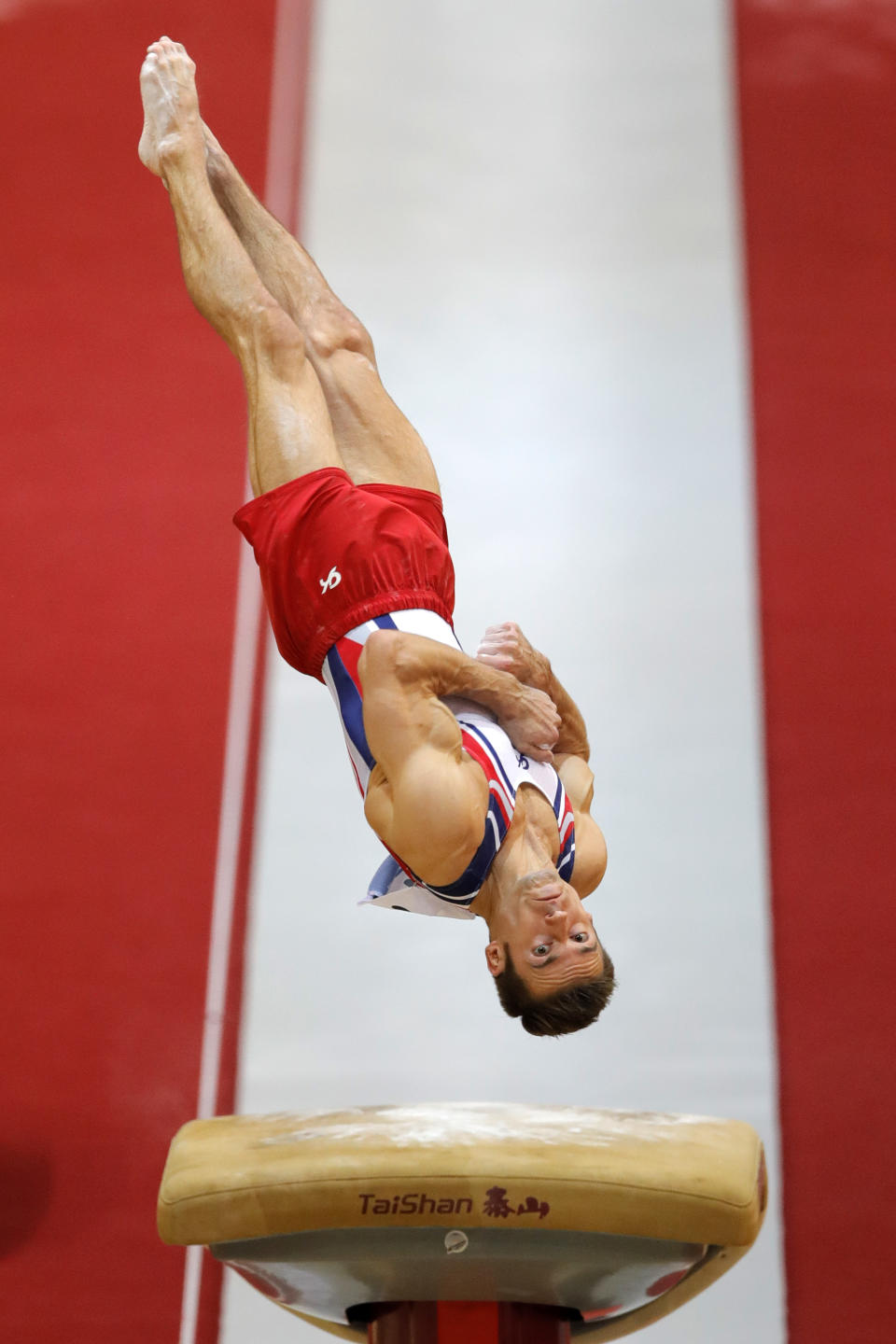Samuel Mikulak of the U.S. performs on the vault during the Men's All-Around Final of the Gymnastics World Chamionships at the Aspire Dome in Doha, Qatar, Wednesday, Oct. 31, 2018. (AP Photo/Vadim Ghirda)