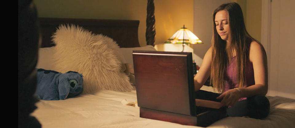 We Go Higher co-director Delaney Colaio in a hotel room, in a scene from the film.