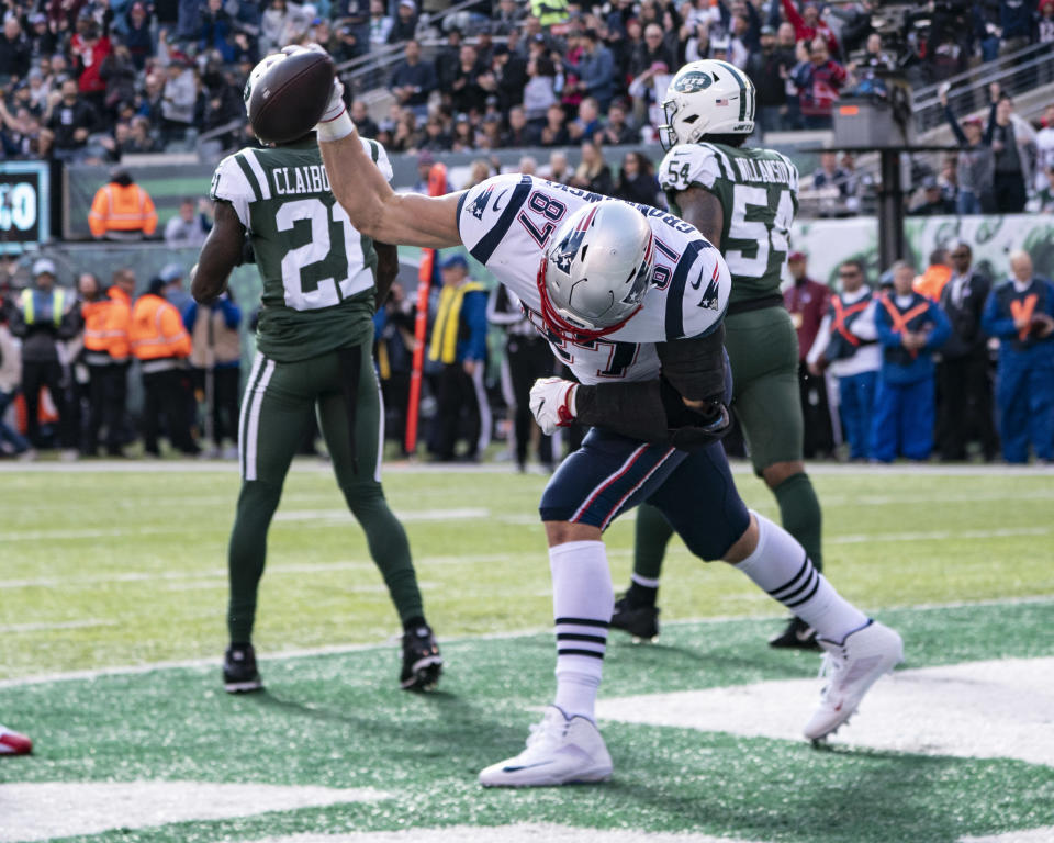 EAST RUTHERFORD, NJ - NOVEMBER 25: New England Patriots Tight End Rob Gronkowski (87) spikes the ball after catching a pass for a touchdown during the first quarter of the New England Patriots versus the New York Jets on November 25, 2018, at MetLife Stadium in East Rutherford, NJ. (Photo by Gregory Fisher/Icon Sportswire via Getty Images)