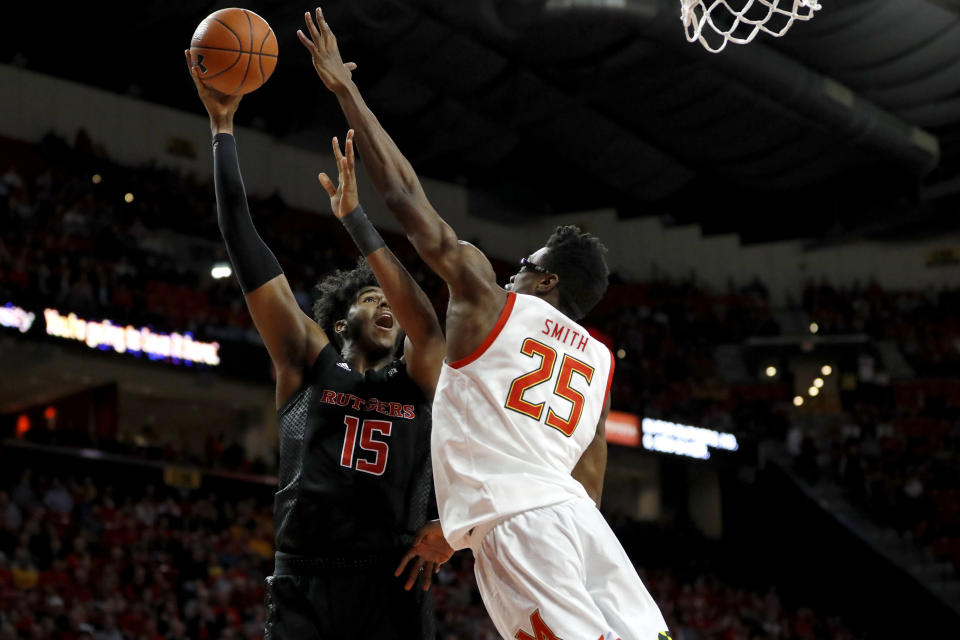 Rutgers center Myles Johnson (15) goes up for a shot against Maryland forward Jalen Smith (25) during the first half of an NCAA college basketball game Tuesday, Feb. 4, 2020, in College Park, Md. (AP Photo/Julio Cortez)