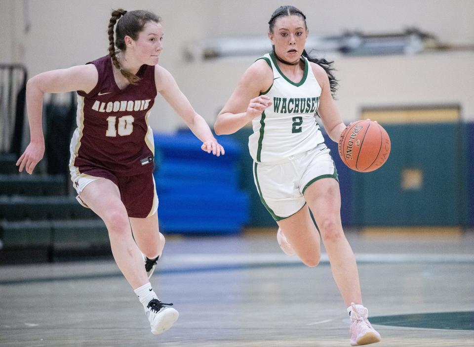 Wachusett's Mary Gibbons tries to dribble past the defense of Algonquin's Katie Cullen.