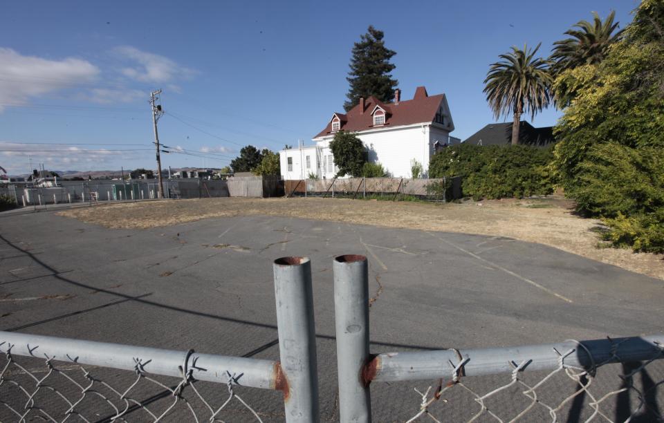 In this photo taken Tuesday, July 17, 2012, is a fenced off city lot that the will be turned into a neighborhood garden in Vallejo, Calif. After the city declared bankruptcy in 2008, community volunteers have formed neighborhood watch groups, clean up graffiti, conduct their own code violation patrols, and the constructionin the community gardens.(AP Photo/Rich Pedroncelli)