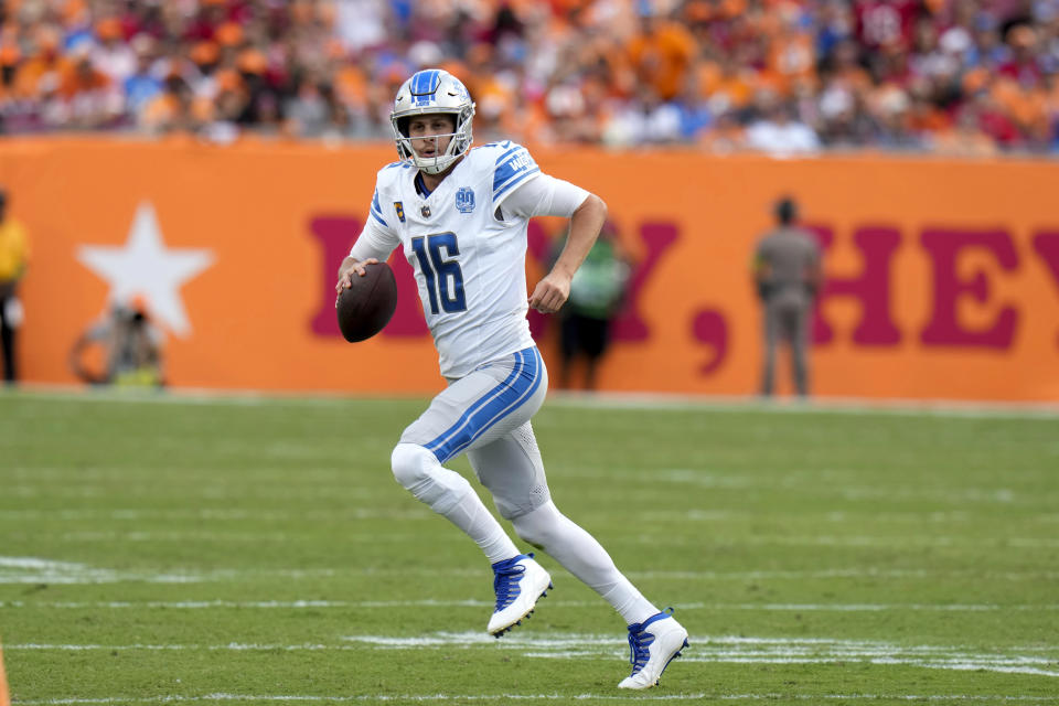 Detroit Lions quarterback Jared Goff (16) rolls out to pass against the Tampa Bay Buccaneers during the first half of an NFL football game Sunday, Oct. 15, 2023, in Tampa, Fla. (AP Photo/Chris O'Meara)