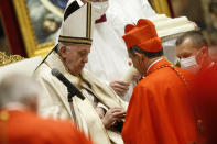 Maltese newly Cardinal Mario Grech receives his biretta as he is appointed cardinal by Pope Francis, during a consistory ceremony where 13 bishops were elevated to a cardinal's rank in St. Peter’s Basilica at the Vatican, Saturday, Nov. 28, 2020. (Fabio Frustaci/POOL via AP)