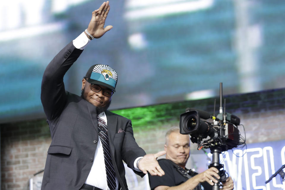 Florida's Jawaan Taylor enters the stage after the Jacksonville Jaguars selected Taylor in the second round of the NFL football draft, Friday, April 26, 2019, in Nashville, Tenn.(AP Photo/Mark Humphrey)