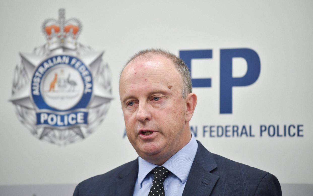 Australian Federal Police Assistant Commissioner Neil Gaughan announces the charges against a