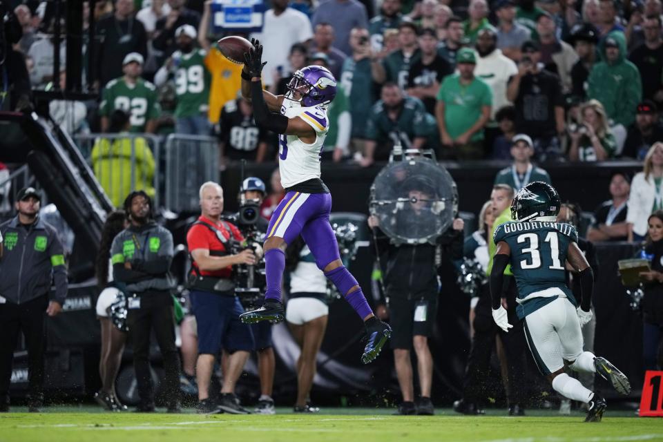 Minnesota Vikings wide receiver Justin Jefferson (18) catches a pass in front of Philadelphia Eagles cornerback Mario Goodrich (31) during the second half of an NFL football game Thursday, Sept. 14, 2023, in Philadelphia. (AP Photo/Matt Slocum)