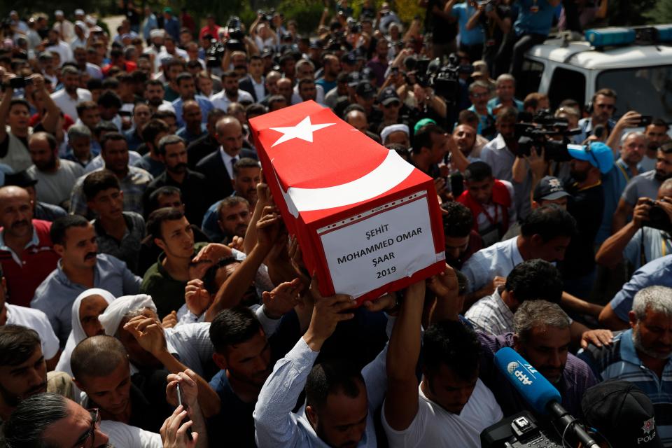 Mourners carry the coffin of ten-month-old Mohammed Omar Saar, killed during incoming shelling from Syria Thursday, in Akcakale, Sanliurfa province, southeastern Turkey, at the border with Syria, Friday, Oct. 11, 2019.