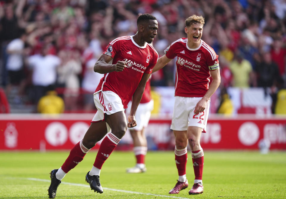 Nottingham Forest's Willy Boly, front, celebrates after scoring his side's first goal during the English Premier League soccer match between Nottingham Forest and FC Chelsea in Nottingham, England, Saturday, May 11, 2024. (Martin Rickett/PA via AP)
