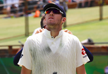 Cricket - Ashes test match - Australia v England - WACA Ground, Perth, Australia, December 17, 2017. England's Craig Overton reacts as a team trainer touches his shoulders before he walks onto the ground at the start of the fourth day of the third Ashes cricket test match. REUTERS/David Gray