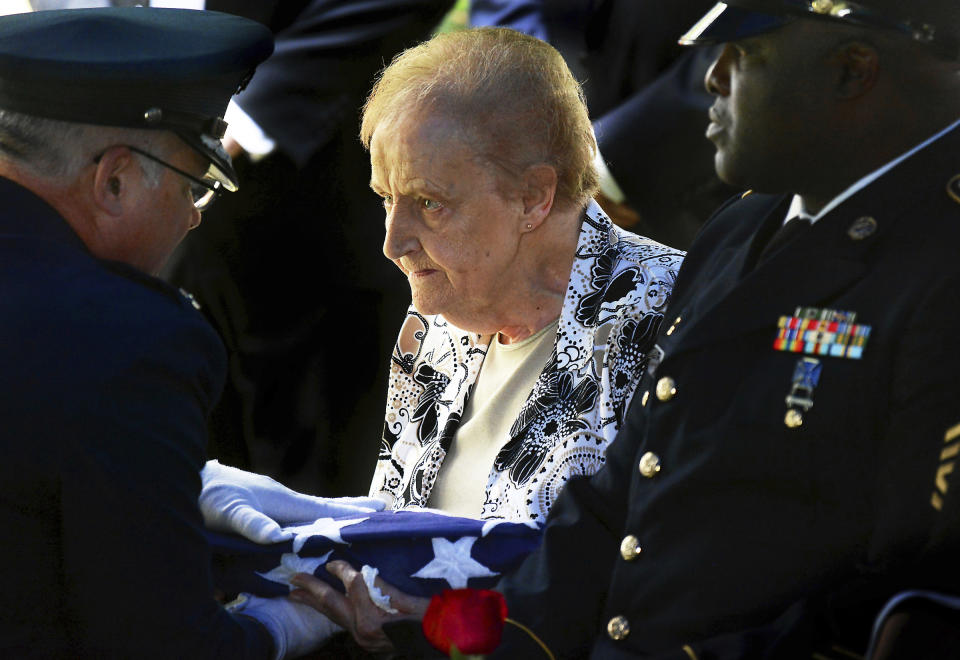 Edna Jenkins, 83, of Scranton, Pa., sister of U.S. Army Pfc. paratrooper Willard "Bud" Jenkins of Scranton, who was killed in action in 1944 during World War II, receives the U.S. flag from her brother's casket on Wednesday, Sept. 26, 2018, at Abington Hills Cemetery in South Abington Township, Pa. ( Butch Comegys / The Scranton Times-Tribune via AP)