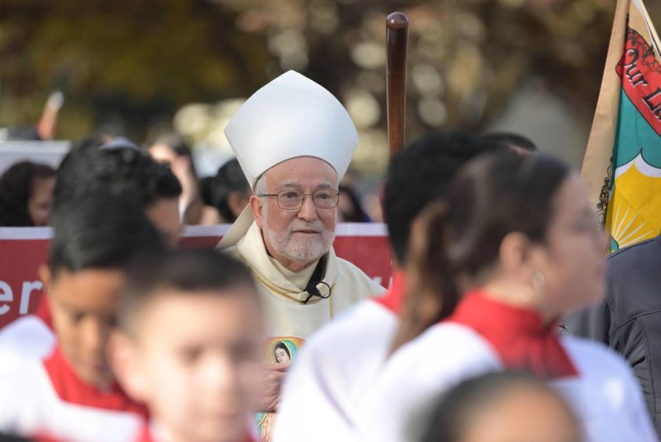 Bishop Jaime Soto, center, marches in a procession to honor Our Lady of Guadalupe, one of the patron saints of the Sacramento diocese, toward the T Street church that bears her name on Dec. 10, 2023, the day after the diocese announced that it would file for bankruptcy protection in the wake of hundreds of sexual abuse lawsuits.