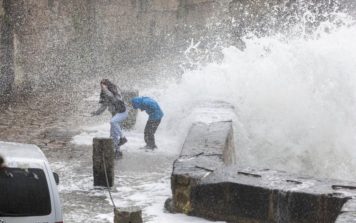 Waves caused by Storm Kathleen hit two walkers in Porthleven, Cornwall