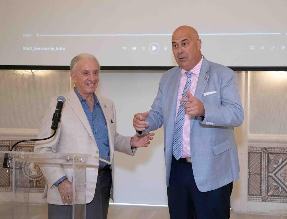 CEO, chairman and co-founder of the Palm Beach Police and Fire Foundation John Scarpa, left, introduces retired Army 1st Sgt. Matt Eversmann.