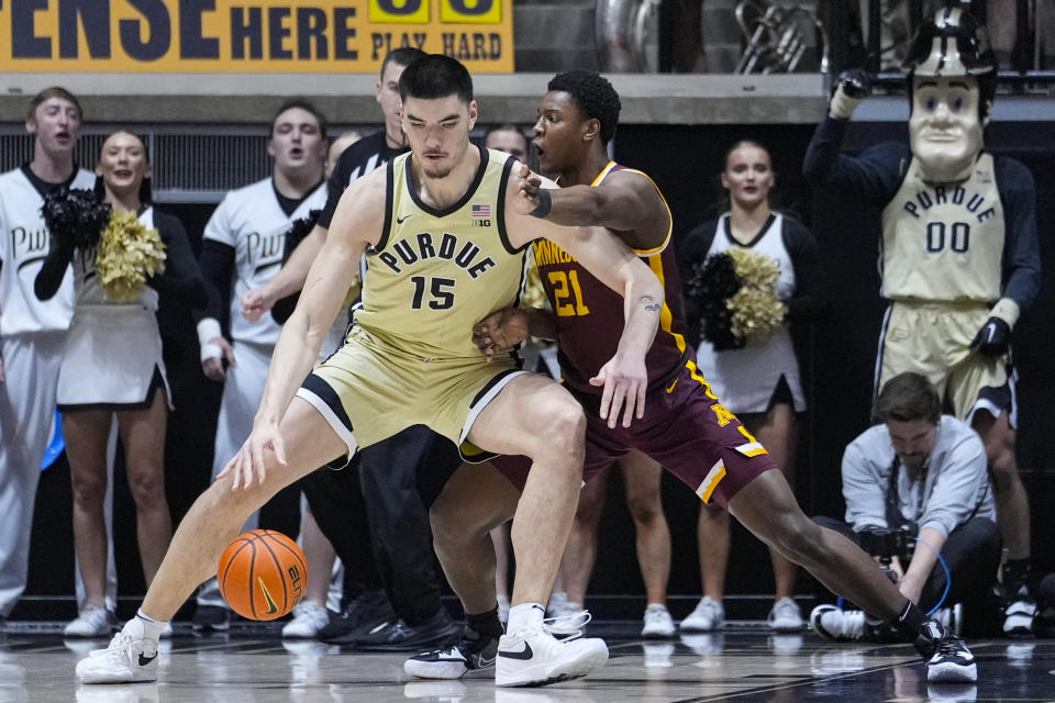 Purdue center Zach Edey (15) drives on Minnesota forward Pharrel Payne (21) during the first half of an NCAA college basketball game in West Lafayette, Ind., Thursday, Feb. 15, 2024. (AP Photo/Michael Conroy)