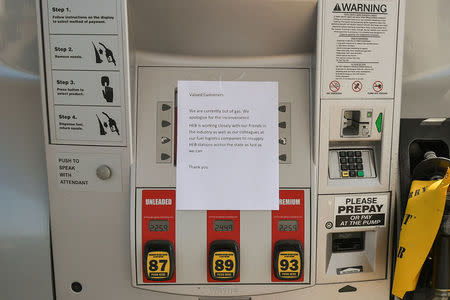 A note is left on a gas pump in the aftermath of Hurricane Harvey in Cedar Park, Texas, U.S., September 1, 2017. REUTERS/Mohammad Khursheed