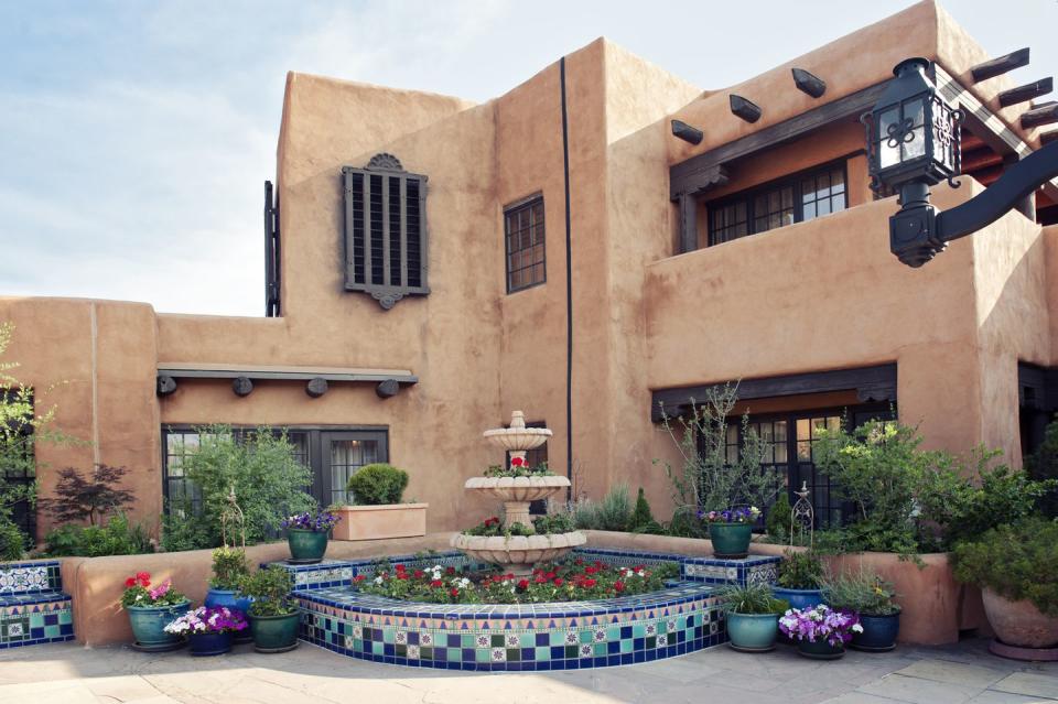 santa fe adobe house with fountain