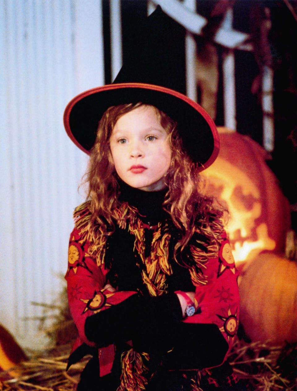 A young Thora wearing a witch's hat and has her arms crossed in a scene from Hocus Pocus