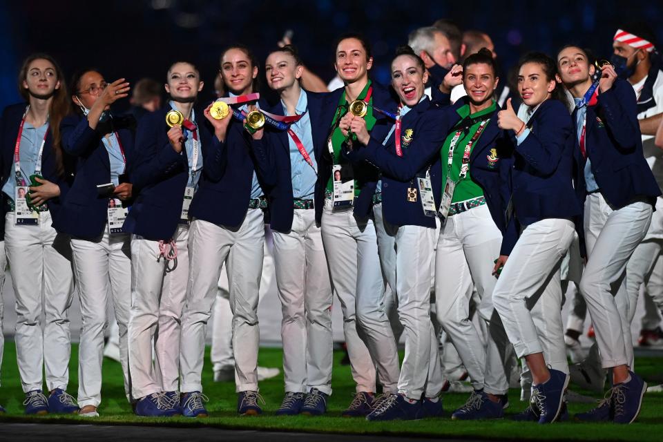 Athletes pose with their gold medals during the closing ceremony of the Tokyo 2020 Olympic Games, on August 8, 2021 at the Olympic Stadium in Tokyo. (Photo by Daniel LEAL-OLIVAS / AFP) (Photo by DANIEL LEAL-OLIVAS/AFP via Getty Images)