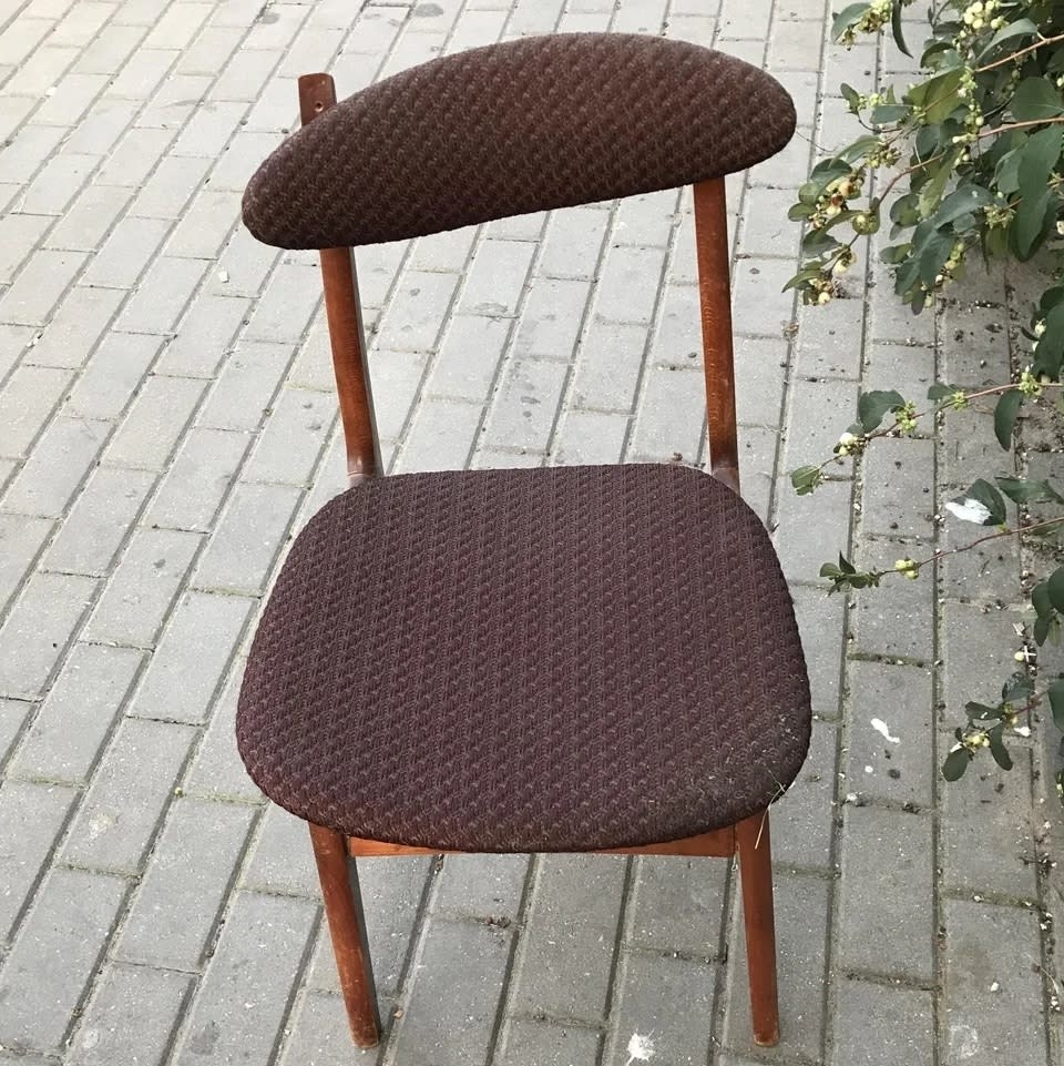 A before image of a broken vintage chair with a dark wood frame and brown cushion