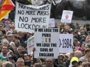 People take part in a 'We Do Not Consent' rally at Trafalgar Square, organised by Stop New Normal, to protest against coronavirus restrictions, in London, Saturday, Sept. 26, 2020. (AP Photo/Frank Augstein)