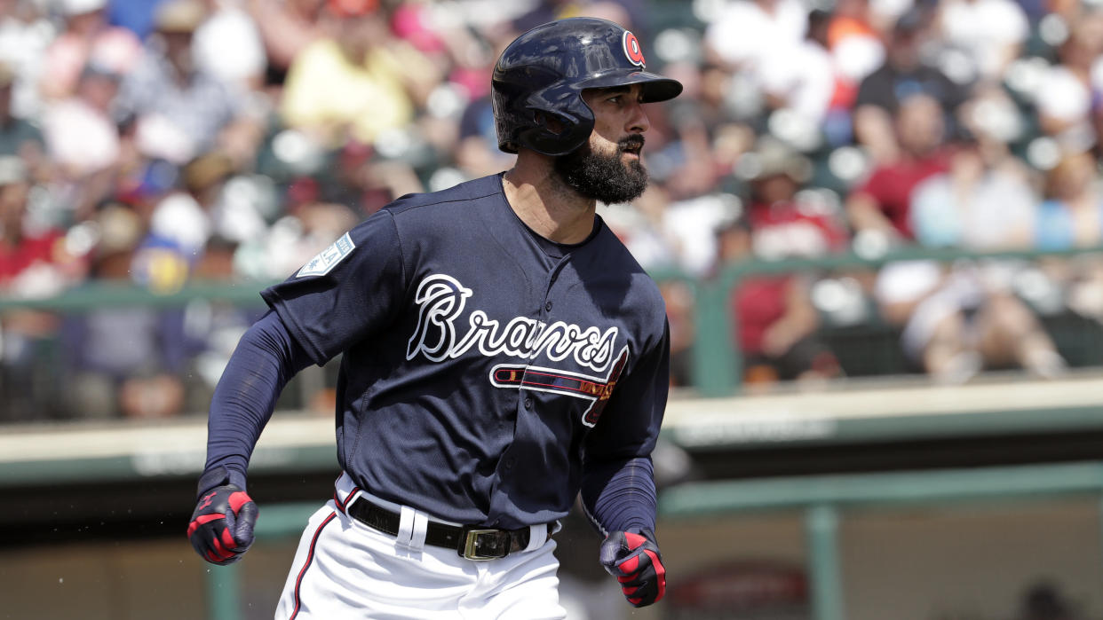 Atlanta Braves' Nick Markakis runs to first base on a hit during a spring baseball exhibition game against the Miami Marlins, Friday, March 15, 2019, in Kissimmee, Fla. (AP Photo/John Raoux)