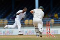 West Indies bowler Kemar Roach (L) celebrates the wicket of Australian batsman Shane Watson (R) during the fourth day of the second-of-three Test matches between Australia and West Indies April 18, 2012 at Queen's Park Oval in Port of Spain, Trinidad.