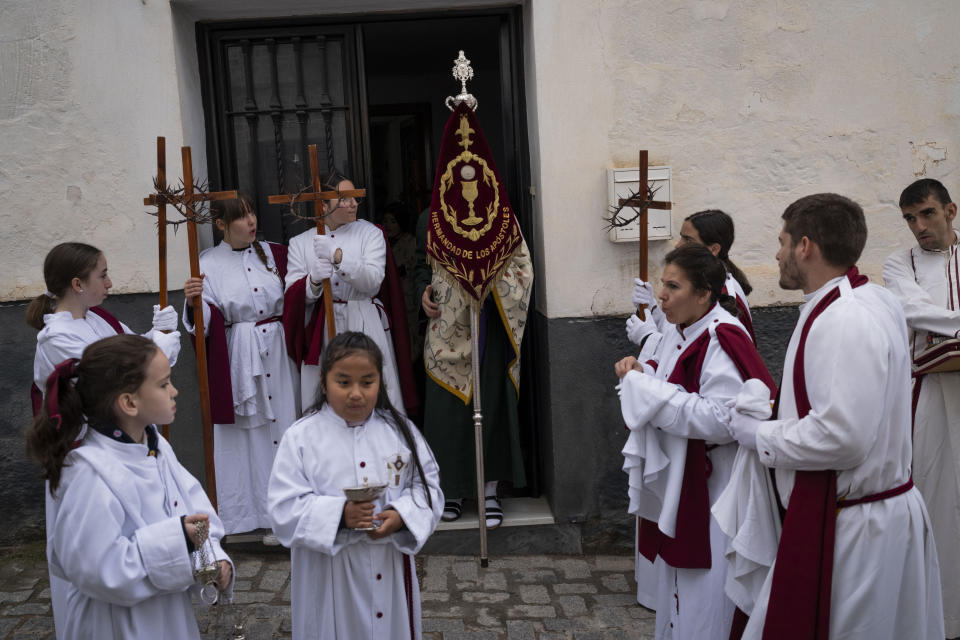 Members of the "Penitencia de los Apóstoles y Discípulos de Jesús" Catholic brotherhood gather for a Holy Week procession in the southern city of Alcala la Real, Spain, on Thursday, March 28, 2024. (AP Photo/Bernat Armangue)