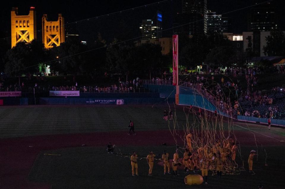 Savanna Bananas’ sing and dance to a closing song after the electricity went out for a second time during the Savannah Bananas World Tour on Saturday, July 29, 2023, at Sutter Health Park in West Sacramento.