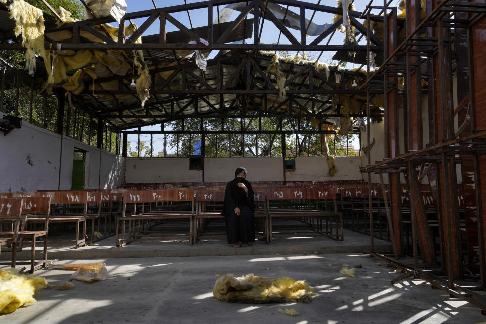 A 19-years old Hazara Afghan girl sits and cries on the bench she was sitting on, during Friday's suicide bomber attack on a Hazara education center, in Kabul, Afghanistan, Saturday, Oct. 1, 2022. Afghanistan's Hazaras, who are mostly Shiite Muslims, have been the target of a brutal campaign of violence for the past several years. (AP Photo/Ebrahim Noroozi)