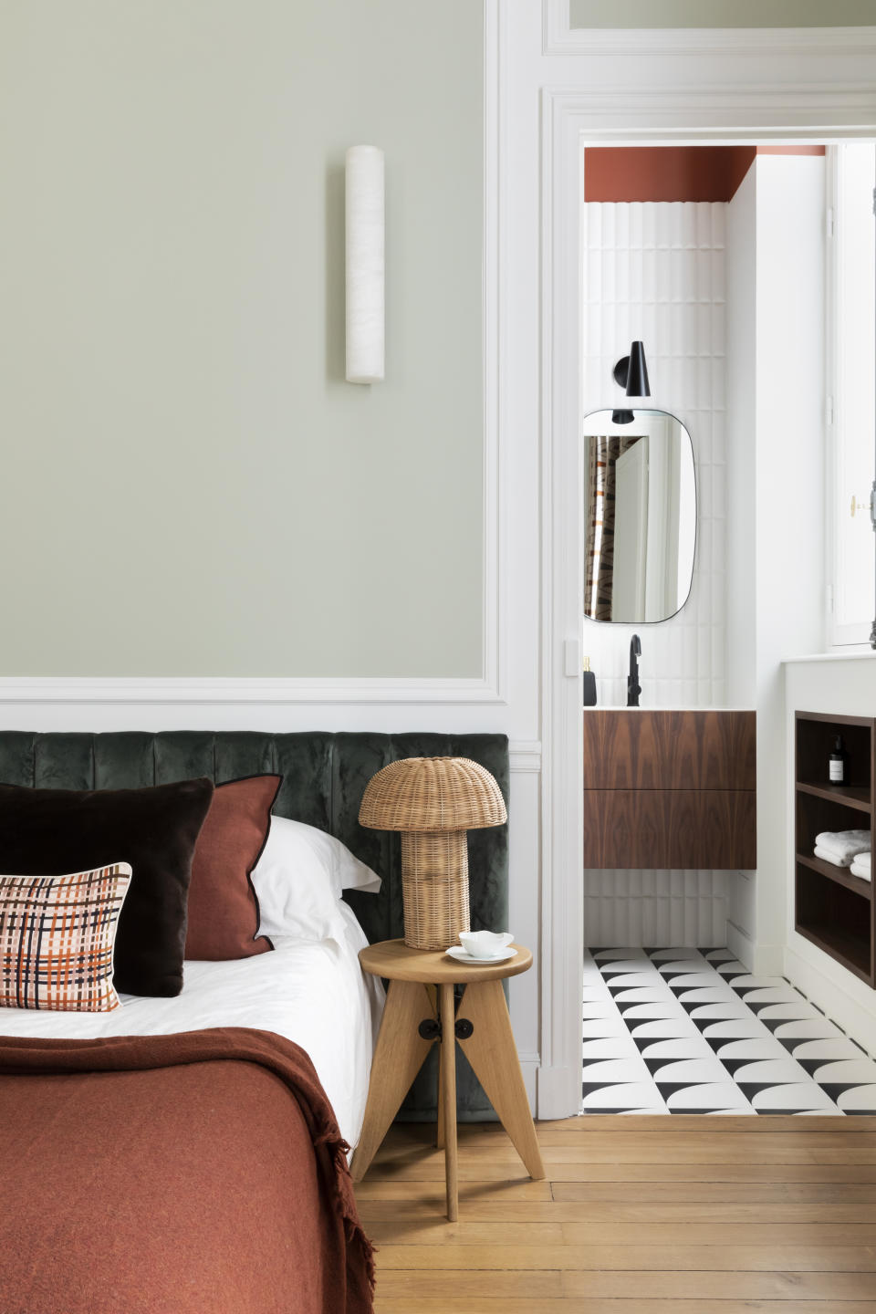 A bedroom headboard in a tufted style in velvet