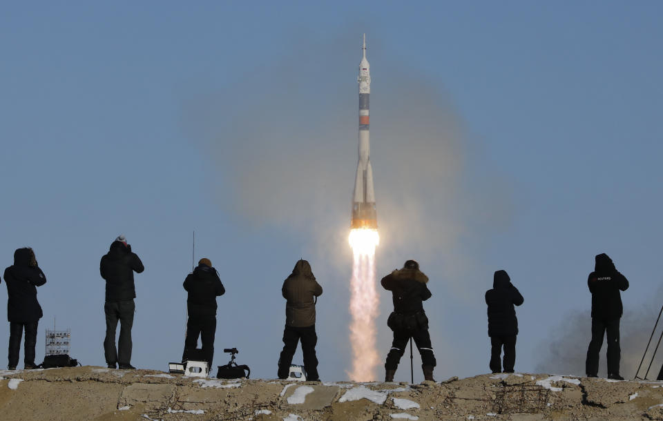 A Soyuz-FG rocket booster with a Soyuz MS-07 spaceship carrying a new crew to the International Space Station blasts off at the Russian-leased Baikonur cosmodrome in Kazakhstan, on Sunday, Dec. 17, 2017. Aboard the Russian rocket are Russian cosmonaut Anton Shkaplerov, U.S. astronaut Scott Tingle, and Japanese astronaut Norishige Kanai. (AP Photo/Dmitri Lovetsky)