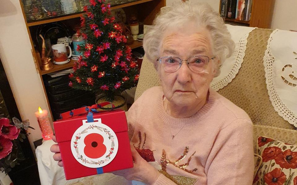 EMBARGOED TO 2200 MONDAY DECEMBER 21 Undated handout photo issued by the Royal British Legion of Vera Parnaby, 81, from Consett, County Durham, who has been a Royal British Legion volunteer for 75 years collecting in excess of Â£1 million for the Poppy Appeal. Vera was a recipient of a Royal British Legion 'Together at Christmas' gift box containing one of the Christmas puddings made by members of the royal family at Buckingham Palace in 2019. The Royal British Legion has gifted 99 Christmas puddings mixed by four generations of the Royal Family to members of the Armed Forces community across the UK and overseas as part of its 'Together at Christmas' initiative. PA Photo. Issue date: Monday December 21, 2020. Those taking part in the get togethers each received one of the special Christmas puddings mixed by the four members of the royal family at Buckingham Palace in December 2019. As well as being delivered to members of the Armed Forces community within the UK, the Legion has sent puddings to individuals and families in Spain, Fiji and to service personnel deployed in Bahrain this Christmas. See PA story ROYAL Christmas. Photo credit should read: Royal British Legion/PA Wire NOTE TO EDITORS: This handout photo may only be used in for editorial reporting purposes for the contemporaneous illustration of events, things or the people in the image or facts mentioned in the caption. Reuse of the picture may require further permission from the copyright holder. - Royal British Legion/PA Wire/Royal British Legion/PA Wire