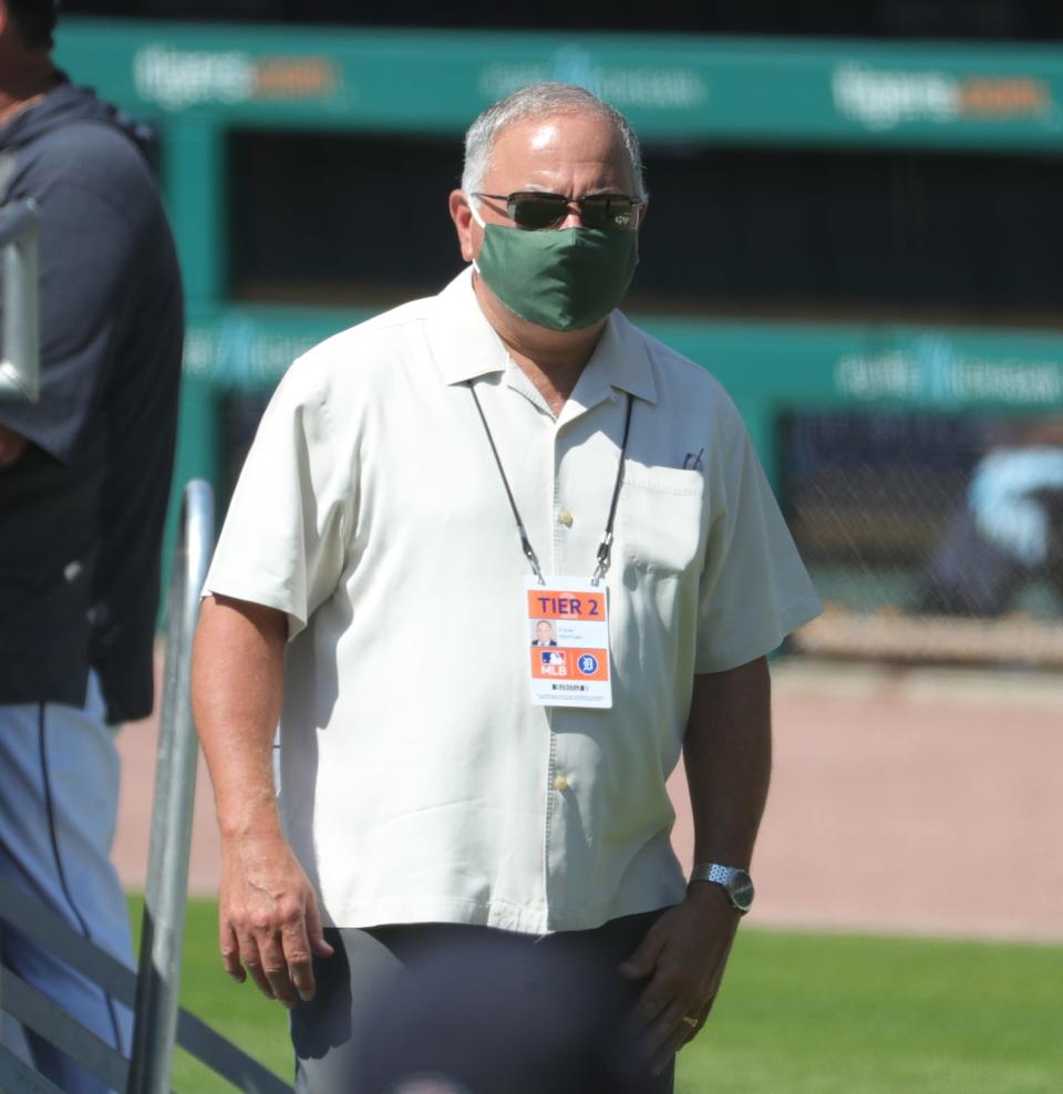 Detroit Tigers general manager Al Avila joins the team on the field at Comerica Park on the first day of workouts during the reboot of training camp.