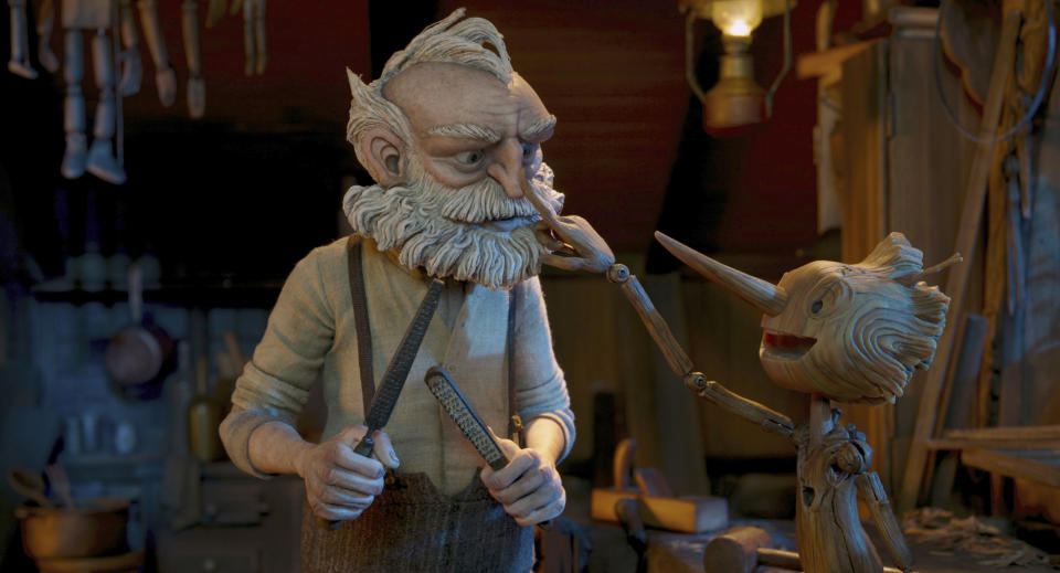 This image released by Netflix shows Gepetto, voiced by David Bradley, left, and Pinocchio, voiced by Gregory Mann, in a scene from "Guillermo del Toro's Pinocchio." (Netflix via AP)