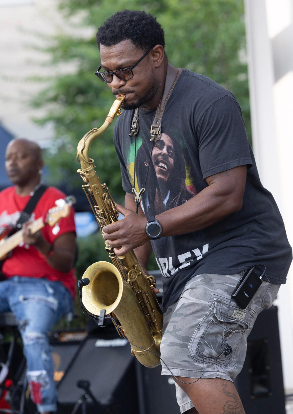 Michael Austin plays saxophone with the Robert Johnson Project at the Downtown Canton Music Fest on Thursday afternoon.