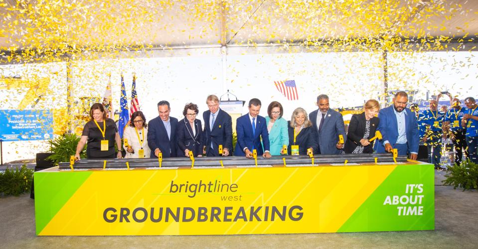 Brightline West officials and guests hammered yellow-colored rail spikes as part of Monday’s groundbreaking celebration for the nation's first high-speed rail system which will connect Las Vegas to Southern California.