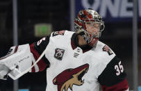 Arizona Coyotes goaltender Darcy Kuemper prepares for play to resume after a timeout in the first period of an NHL hockey game against the Colorado Avalanche, Monday, March 8, 2021, in downtown Denver. (AP Photo/David Zalubowski)