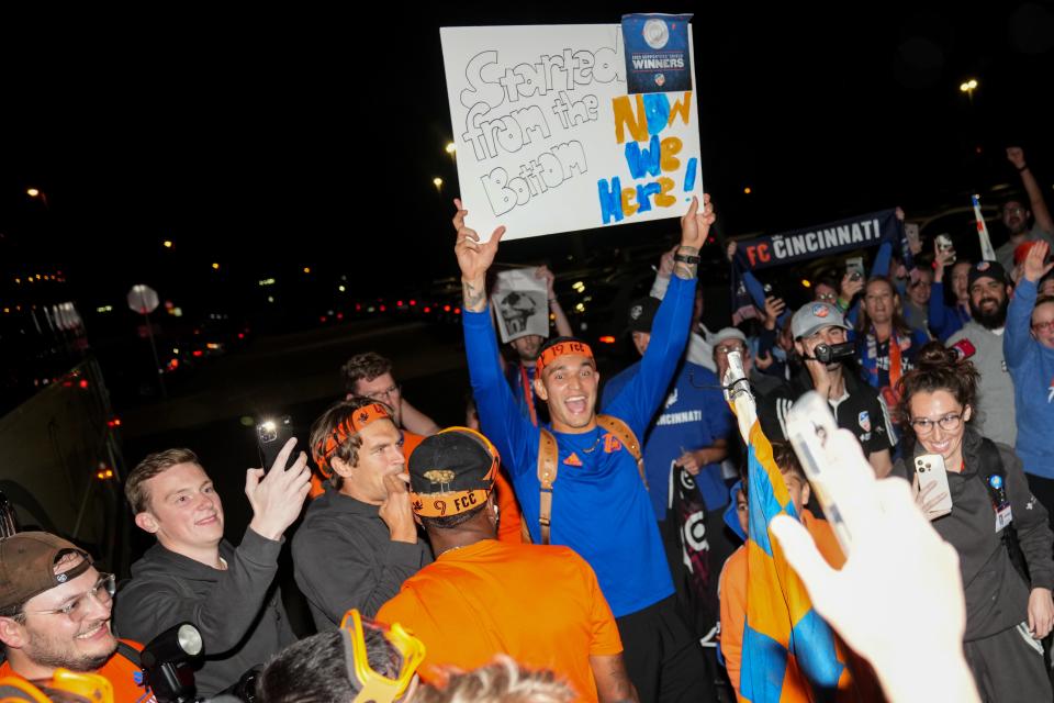 FC Cincinnati defender Nick Hagglund and forward Brandon Vazquez celebrate with fans and the rest of the team after they arrive at the Cincinnati/Northern Kentucky International Airport after defeating Toronto FC, 3-2, to win the Supporters Shield trophy, or best regular-season record based Major League Soccer point system, Sunday, Oct. 1, 2023, in Hebron, Ky.