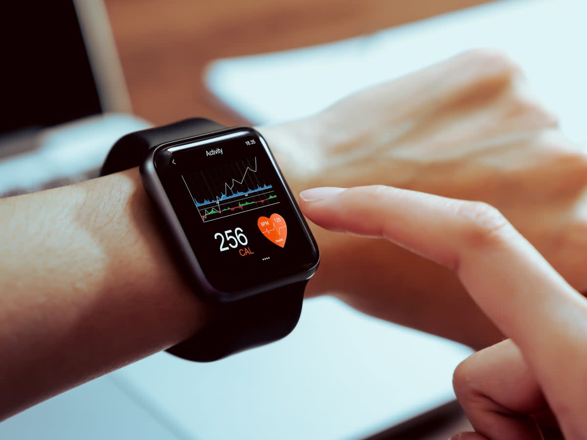Close up of hand touching smartwatch with health app on the screen (Getty Images) (Getty Images)