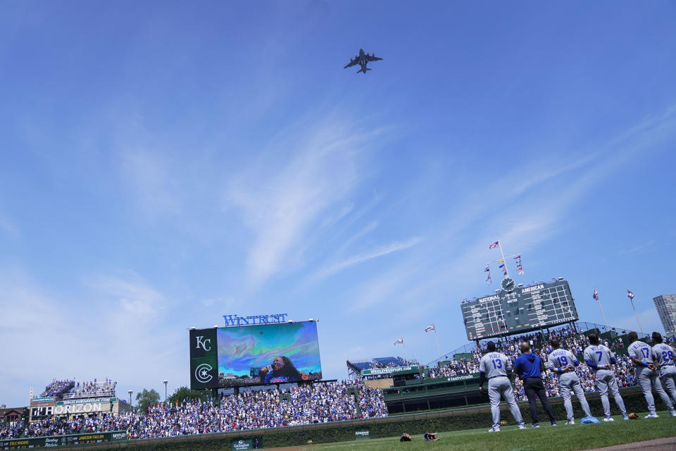 A U.S. Air Force C-17 plane flies over Wrigley Field before a baseball game between the Kansas City Royals and Chicago Cubs, Friday, Aug. 18, 2023, in Chicago. (AP Photo/Erin Hooley)