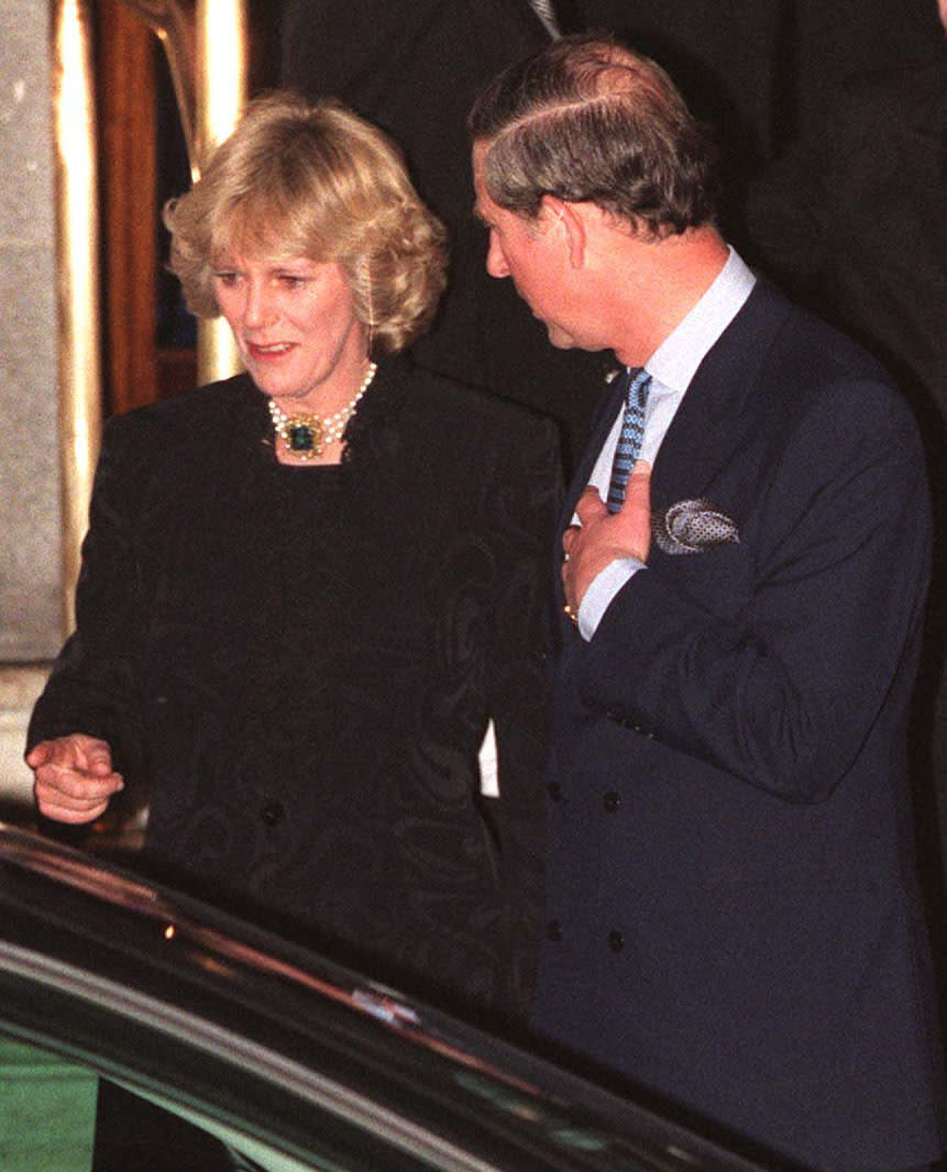 Camilla Parker Bowles and Prince Charles walk out of the Ritz January 28, 1999. More than 100 photographers took up positions outside London&#39;s Ritz hotel for the most elusive shot of all -- Prince Charles together with his long-time lover Camilla Parker Bowles. (photo by UK Press)
